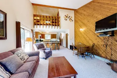 a living room with a couch and a table at Vasquez Vista in Winter Park