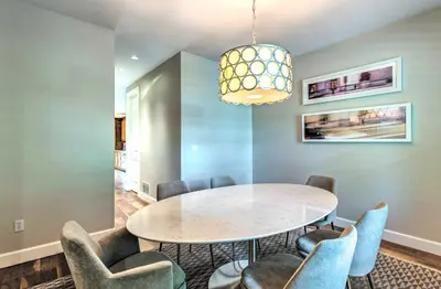 a dining room with a table and chairs at Hot Tub and Outdoor Oasis Luxury Denver Home in Denver
