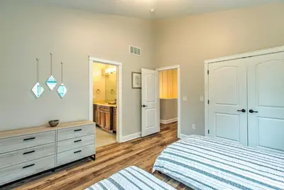 a bedroom with a bed and a dresser at Hot Tub and Outdoor Oasis Luxury Denver Home in Denver