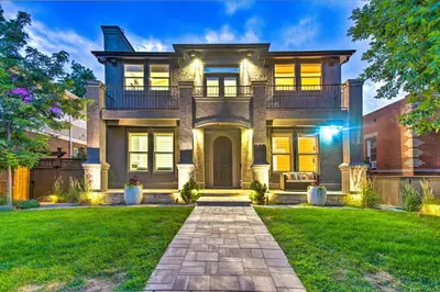 a large house with a pathway in front of it at Hot Tub and Outdoor Oasis Luxury Denver Home in Denver