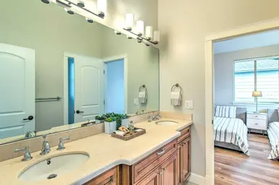 a bathroom with two sinks and a large mirror at Hot Tub and Outdoor Oasis Luxury Denver Home in Denver