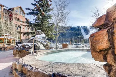 a hot tub in a resort in the snow at The Springs Condominiums by Vail Resorts in Keystone