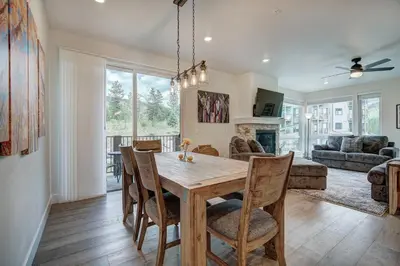 a dining room and living room with a table and chairs at Clearwater Lofts by Vail Resorts in Keystone