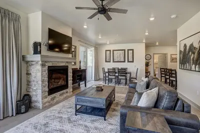 a living room with a couch and a fireplace at Clearwater Lofts by Vail Resorts in Keystone
