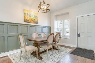 a dining room with a wooden table and chairs at 6 Mi to Dtwn Arvada Home with Hot Tub and Yard in Arvada