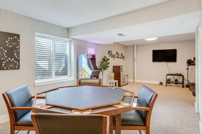a living room with a ping pong table and chairs at 6 Mi to Dtwn Arvada Home with Hot Tub and Yard in Arvada