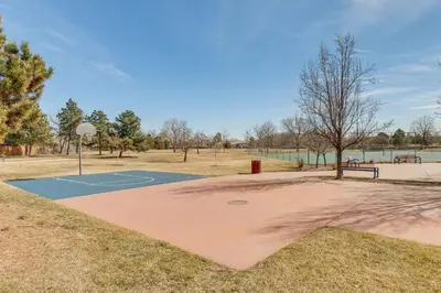 a basketball court in a park with a basketball hoop at 6 Mi to Dtwn Arvada Home with Hot Tub and Yard in Arvada
