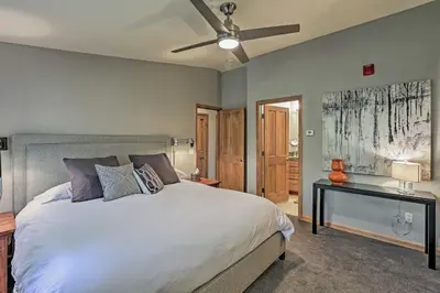 a bedroom with a bed and a ceiling fan at Walk to Main St Frisco Condo with Furnished Deck in Frisco