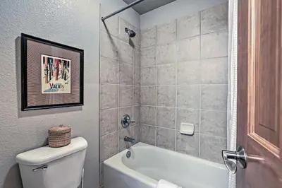 a bathroom with a tub and a toilet and a sink at Walk to Main St Frisco Condo with Furnished Deck in Frisco