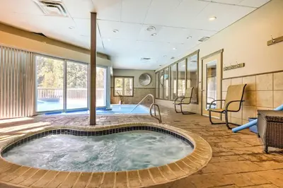a jacuzzi tub in the middle of a room at Walk to Main St Frisco Condo with Furnished Deck in Frisco