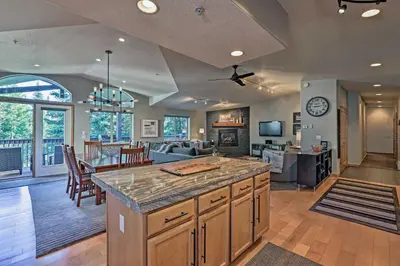 a kitchen and living room with a large island at Walk to Main St Frisco Condo with Furnished Deck in Frisco