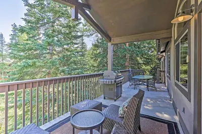 a screened porch with a grill and chairs and tables at Walk to Main St Frisco Condo with Furnished Deck in Frisco