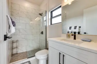 a bathroom with a toilet and a sink and a shower at Sleek Fraser Townhome Less Than 8 Mi to Winter Park! in Fraser