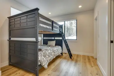 a bunk bed in a room with a bed in a room at Sleek Fraser Townhome Less Than 8 Mi to Winter Park! in Fraser