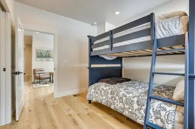 a bedroom with a bunk bed and a desk at Sleek Fraser Townhome Less Than 8 Mi to Winter Park! in Fraser