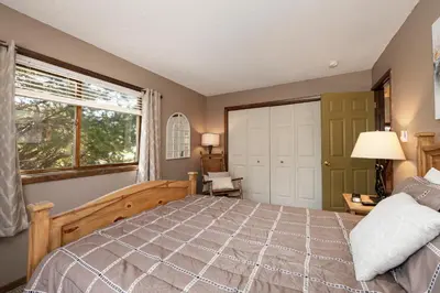 a bedroom with a bed and a window at Twin Rivers Vasquez 3 by Stay Winter Park in Fraser