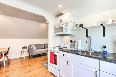 a kitchen with a sink and a stove top oven at 2 Mi to Downtown Denver Chic Apartment! in Denver