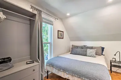 a bedroom with a bed and a window at 2 Mi to Downtown Denver Chic Apartment! in Denver