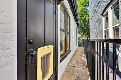a black door with a window on a house at 2 Mi to Downtown Denver Chic Apartment! in Denver