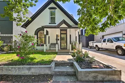 a white truck parked in front of a house at 2 Mi to Downtown Denver Chic Apartment! in Denver