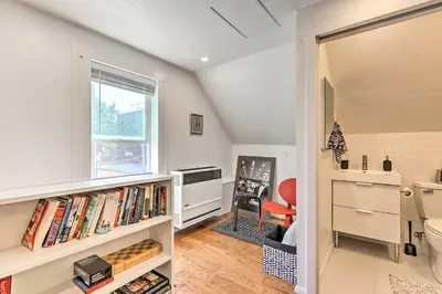 a room with a window and a book shelf with books at 2 Mi to Downtown Denver Chic Apartment! in Denver