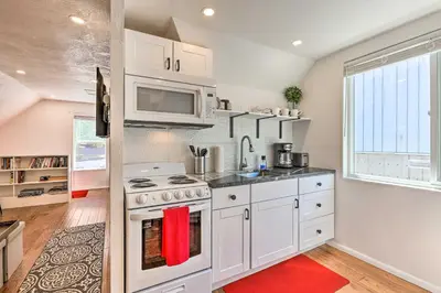 a kitchen with a stove and a microwave at 2 Mi to Downtown Denver Chic Apartment! in Denver