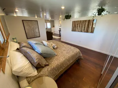 a bedroom with a bed with pillows on it at Roof-top stay, king-size bed, views of Loveland in Loveland