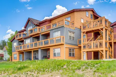 a large apartment building with wooden balconies at Condo Near Winter Park Resort and Steps From Shuttle in Fraser