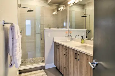 a bathroom with a sink and a shower at City Skyline Views Upscale Denver Townhome in Denver