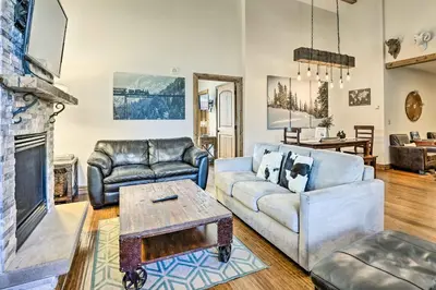 a living room with two couches and a fireplace at Winter Park Condo with Mountain Views and Hot Tub in Winter Park