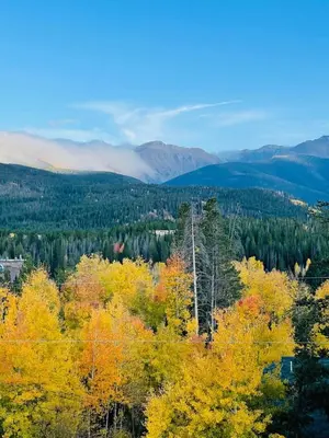 an autumn view of the mountains with trees and clouds at 10 min to Resort! Amazing Views & Sauna! in Winter Park