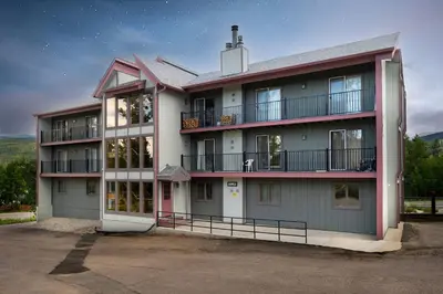 a large apartment building with a lot of windows at 10 min to Resort! Amazing Views & Sauna! in Winter Park