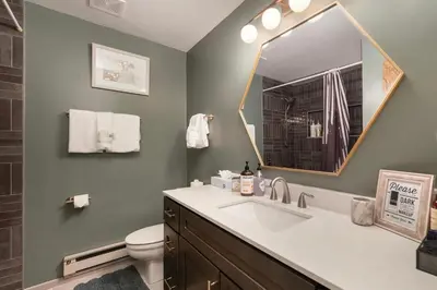 a bathroom with a sink and a mirror at 10 min to Resort! Amazing Views & Sauna! in Winter Park