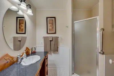 a bathroom with a sink and a shower at Loveland Townhome Walkable to Lake and Park! in Loveland