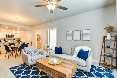 a living room with a couch and a table at Elegant Loveland Condo Less Than 5 Mi to Old Town! in Loveland