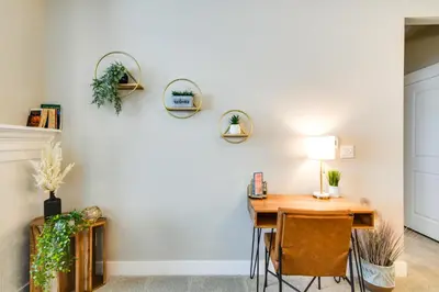 a dining room with a table and chairs at Elegant Loveland Condo Less Than 5 Mi to Old Town! in Loveland