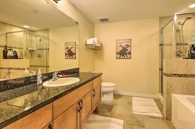 a bathroom with a sink and a shower and a toilet at Charming Winter Park Condo - Steps to Slopes! in Winter Park