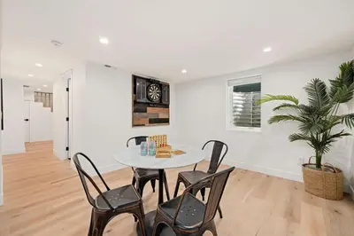a dining room with a table and chairs at Elegant Old Town Charm - Walk to CSU and Downtown in Fort Collins