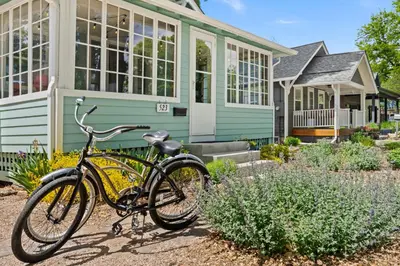 a bike parked in front of a house at Downtown Abode with Hot Tub - Walk to CSU & Old Town in Fort Collins