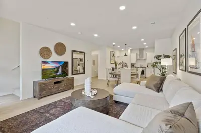 a living room with a couch and a table at NEW! Cozy Colorado Living - 8 min from Old Town! in Fort Collins