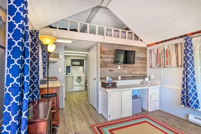 a tiny house with a kitchen and a loft at 6 Mi to Ski Resort! Lakefront Breckenridge Cabin in Breckenridge