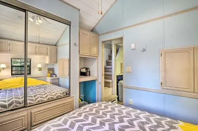 a small bedroom with a bed in a room at 6 Mi to Ski Resort! Lakefront Breckenridge Cabin in Breckenridge