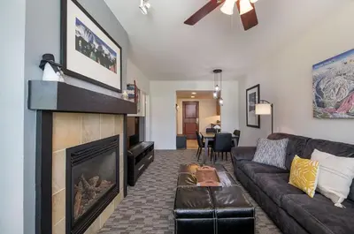 a living room with a couch and a fireplace at Winter Park FF Premium-Rated 4470 in Winter Park