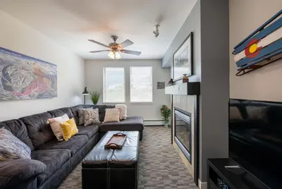 a living room with a couch and a tv at Winter Park FF Premium-Rated 4470 in Winter Park