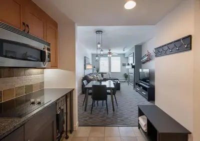 a kitchen and living room with a table and a dining room at Winter Park FF Premium-Rated 4470 in Winter Park