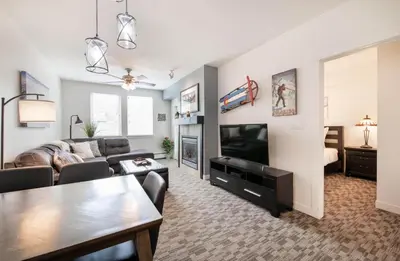 a living room with a couch and a tv at Winter Park FF Premium-Rated 4470 in Winter Park