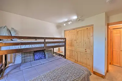 a bedroom with two bunk beds and a closet at Cozy and Chic Mountain Condo with Community Perks in Fraser