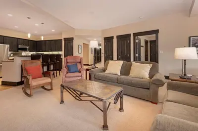 a living room with a couch and a table at Parry Peak Loft Premium-Rated 105 in Winter Park