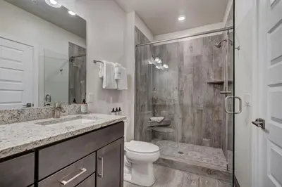 a bathroom with a shower and a toilet and a sink at Brand New Clear Water Lofts - 2br Premier Condo - Kids Ski Free, No CF condo in Keystone