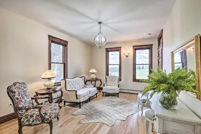 a living room with chairs and a couch at Mtn View and Group Ready Conifer Home on 100 Acres! in Conifer